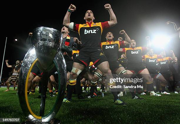 Aaron Cruden of the Chiefs leads the Haka as they celebrate winning the Super Rugby Final between the Chiefs and the Sharks at Waikato Stadium on...