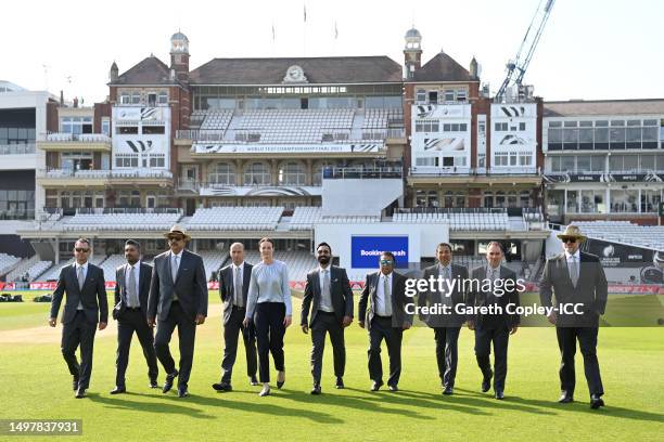 The ICC Television Commentators pose for a photo on the field prior on day five of the ICC World Test Championship Final between Australia and India...