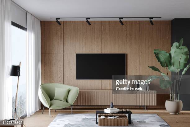 living room with tv and armchair - insight tv stock pictures, royalty-free photos & images