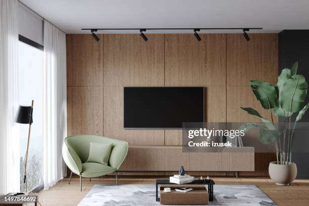 living room with tv and armchair - three dimensional tv stock pictures, royalty-free photos & images