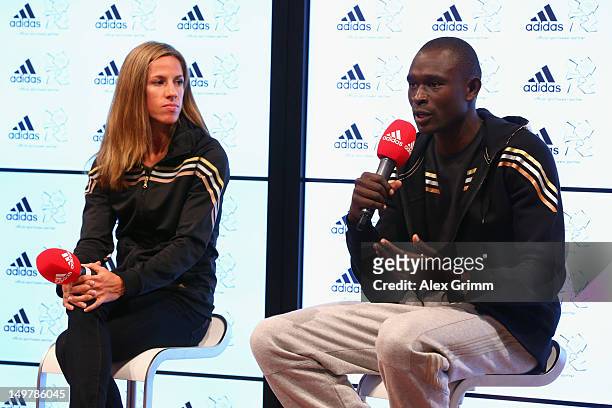 Morgan Uceny of the United States and David Rudisha of Kenya at the adidas Olympic Media Lounge at Westfield Stratford City on August 4, 2012 in...