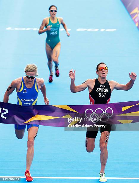 Lisa Norden of Sweden , Nicola Spirig of Switzerland , and Erin Densham of Australia finish the Women's Triathlon on Day 8 of the London 2012 Olympic...