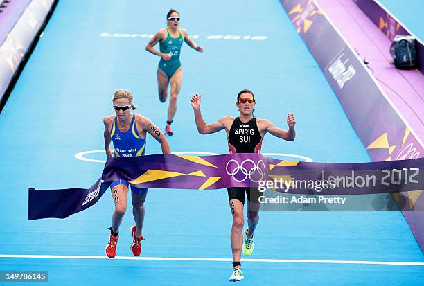 Lisa Norden of Sweden , Nicola Spirig of Switzerland , and Erin Densham of Australia finish the Women's Triathlon on Day 8 of the London 2012 Olympic...