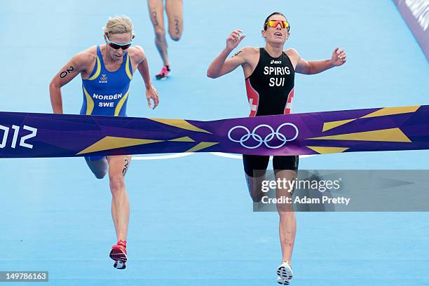 Lisa Norden of Sweden and Nicola Spirig of Switzerland finish the Women's Triathlon on Day 8 of the London 2012 Olympic Games at Hyde Park on August...