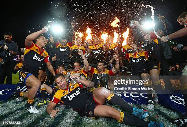 Chiefs players celebrate with the Super Rugby Cup after defeating the Sharks during the Super Rugby Final between the Chiefs and the Sharks at...