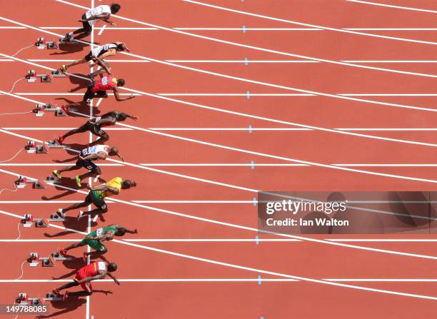 James Dasaolu of Great Britain and Usain Bolt of Jamaica starts in the Men's 100m Round 1 Heats on Day 8 of the London 2012 Olympic Games at Olympic...