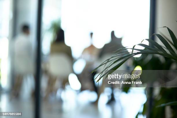blurry image of a meeting - bokeh stock pictures, royalty-free photos & images