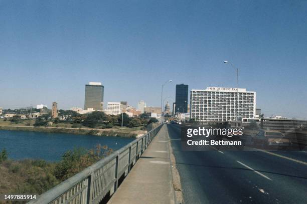View of the Austin skyline from Congress Avenue Bridge in Austin, Texas, 1975. The Sheraton Crest Inn can be seen on the right.