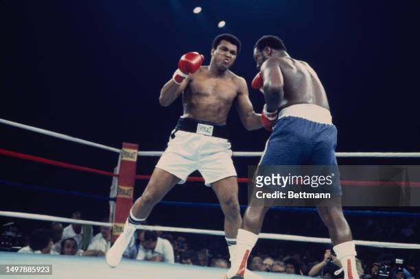 Heavyweight boxers Muhammad Ali and Joe Frazier in action during their championship bout in Quezon City, Manila, Philippines, October 1st 1975.