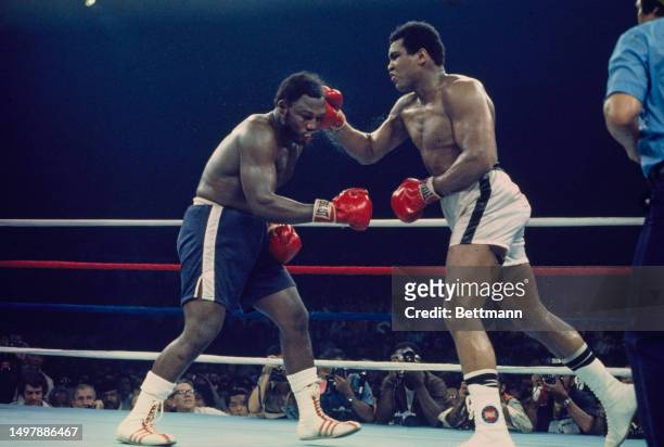 Heavyweight boxers Muhammad Ali and Joe Frazier in action during their championship bout in Quezon City, Manila, Philippines, October 1st 1975.