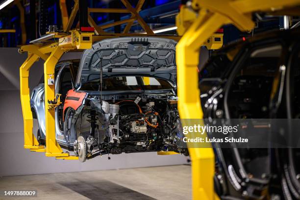 Electric Ford Explorer is seen as the German Chancellor Olaf Scholz visits the electric car production line at the Ford automobile factory on June...