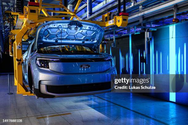 Electric Ford Explorer is seen as the German Chancellor Olaf Scholz visits the electric car production line at the Ford automobile factory on June...