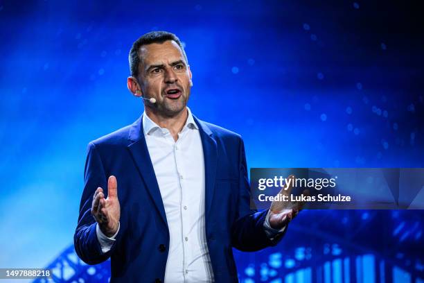 Martin Sander, Chair Ford-Werke GmbH, speaks on stage at the electric car production line at the Ford automobile factory on June 12, 2023 in Cologne,...