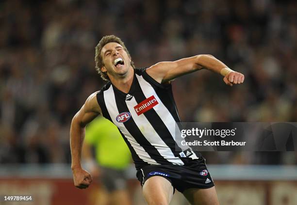 Dale Thomas of the Magpies celebrates after kicking a goal during the round 19 AFL match between the Collingwood Magpies and the St Kilda Saints at...