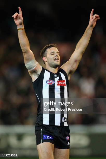 Nathan Brown of the Magpies celebrates a win during the round 19 AFL match between the Collingwood Magpies and the St Kilda Saints at the Melbourne...