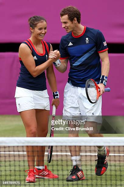 Laura Robson and Andy Murray of Great Britain celebrate after defeating Samantha Stosur and Lleyton Hewitt of Australia to win their Mixed Doubles...