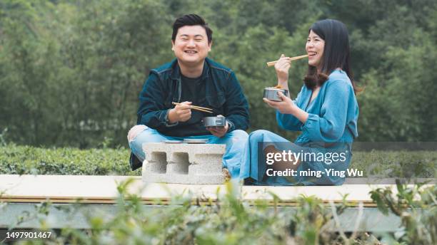 tea garden guided tour, and couple having lunch time in the tea garden - asian couple having hi tea stock pictures, royalty-free photos & images