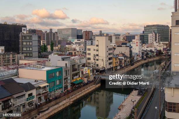 sunset over fukuoka city in japan - 川 日本 ストックフォトと画像