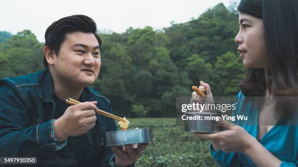 tea garden guided tour, and couple having lunch time in the tea garden - asian couple having hi tea stock pictures, royalty-free photos & images