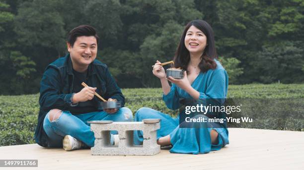 tea garden guided tour, and couple having lunch time in the tea garden - asian couple having hi tea stock pictures, royalty-free photos & images