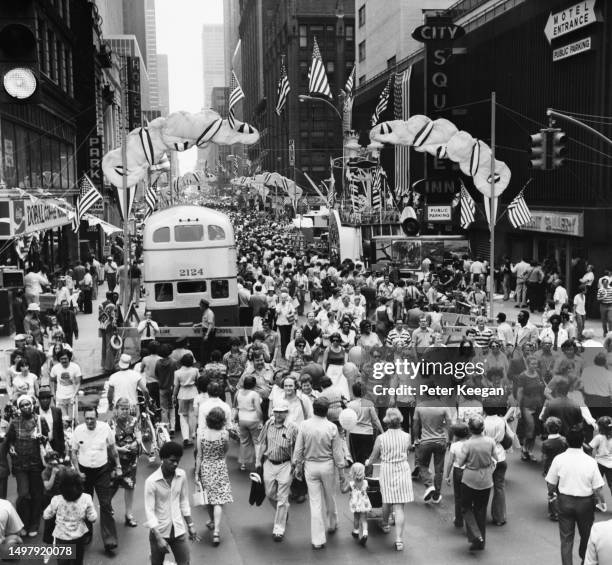 Crowds fill the street during an Americana Fair on 52nd Street in the borough of Manhattan, New York City, New York, 20th June 1976. . The...