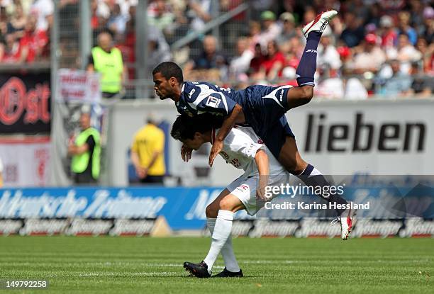 Dennis Mast of Halle challenges Phil Ofosu-Ayeh of Erfurt during the 3.Liga match between Hallescher FC and RW Erfurt at the Erdgas-Sportpark on...