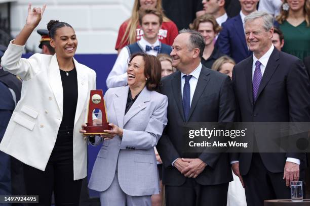 Vice President Kamala Harris is presented with a trophy by University of Texas at Austin volleyball player Logan Eggleston as Harris’ husband Douglas...