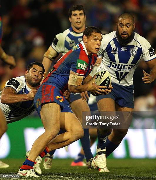 Timana Tahu of the Knights tries to break clear during the round 22 NRL match between Canterbury-Bankstown Bulldogs and Newcastle Knights at Hunter...