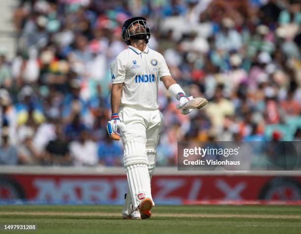 Ajinkya Rahane of India leaves the field after being dismissed during day five of the ICC World Test Championship Final between Australia and India...