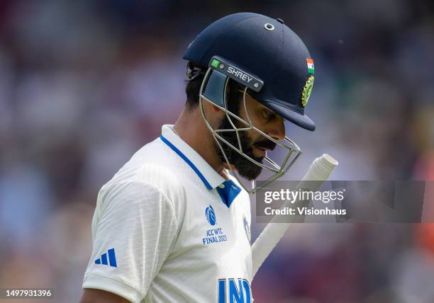 Virat Kohli of India walks off the pitch after losing his wicket to Scott Boland of Australia during day five of the ICC World Test Championship...