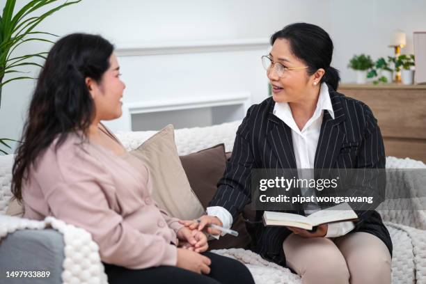 professional therapist conversation with clients or patients. to listen to the problems of patients along with providing encouragement and advice on solving problems for customers with mental health problems - vulnerability stock pictures, royalty-free photos & images
