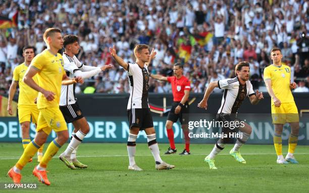 Joshua Kimmich of Germany celebrates after scoring the team's third goal during the International Friendly match between Germany and Ukraine at...