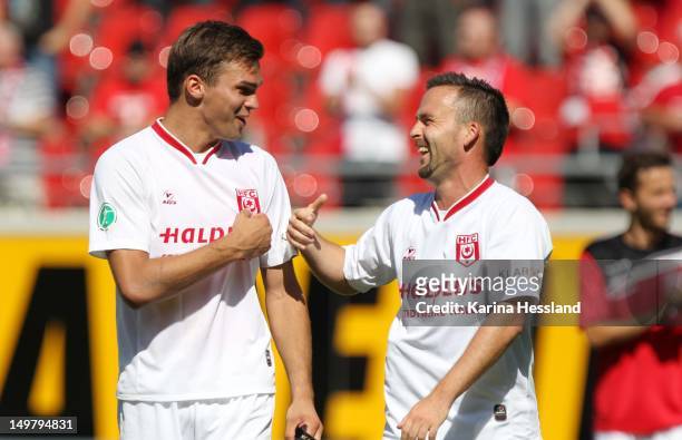 Nils Pichinot and Nico Kanitz of Halle celebrate victory during the 3.Liga match between Hallescher FC and RW Erfurt at the Erdgas-Sportpark on...