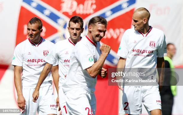 Maik Wagefeld of Halle celebrates their 3:0 victory during the 3.Liga match between Hallescher FC and RW Erfurt at the Erdgas-Sportpark on August 04,...