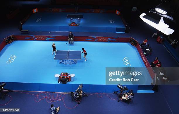 Jiaduo Wu of Germany serves to Kasumi Ishikawa of Japan during the quarterfinals of the Women's Team Table Tennis match on Day 8 of the London 2012...