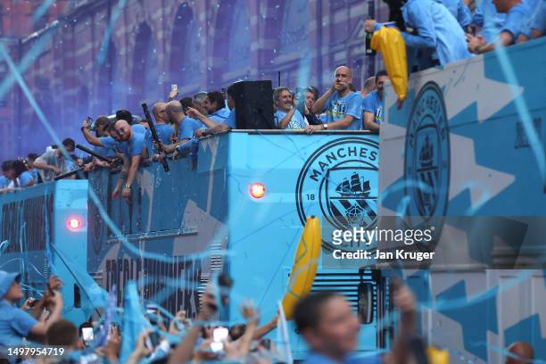 Manchester City manager Pep Gardiola waves from the back of the bus as players of Manchester City celebrate on the Open-Top Bus, which read "Treble...
