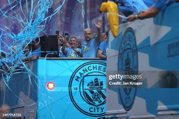 Manchester City manager Pep Gardiola waves from the back of the bus as players of Manchester City celebrate on the Open-Top Bus, which read "Treble...