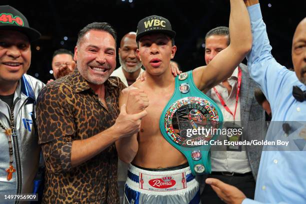 Oscar De La Hoya and Jaime Munguia pose for a photo at Toyota Arena on June 10, 2023 in Ontario, California.