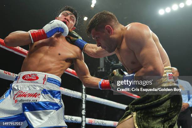 Jaime Munguia gets hit by a punch from Sergiy Derevyanchenko at Toyota Arena on June 10, 2023 in Ontario, California.