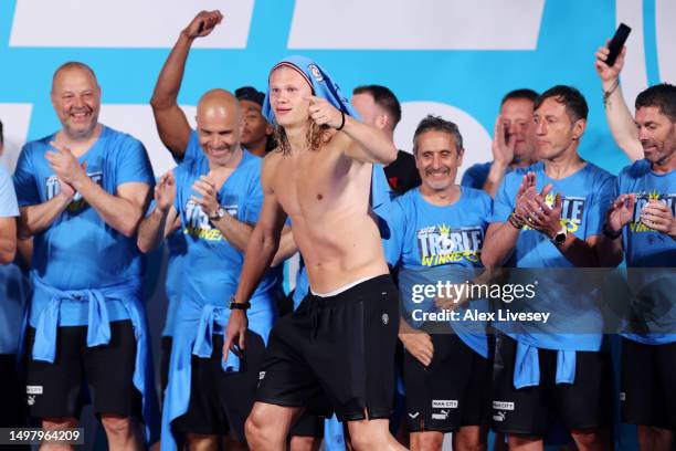 Erling Haaland of Manchester City celebrates on stage in St Peter's Square during the Manchester City trophy parade on June 12, 2023 in Manchester,...