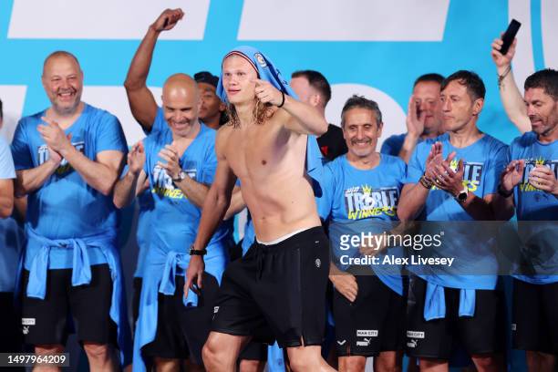 Erling Haaland of Manchester City celebrates on stage in St Peter's Square during the Manchester City trophy parade on June 12, 2023 in Manchester,...