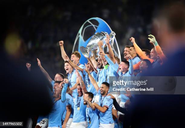 Ilkay Guendogan of Manchester City lifts the UEFA Champions League trophy after the team's victory during the UEFA Champions League 2022/23 final...
