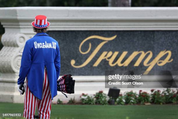 Supporter of former President Donald Trump waits for him to arrive at the Trump National Doral Miami resort on June 12, 2023 in Doral, Florida. Trump...