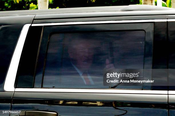 Republican presidential candidate former U.S. President Donald Trump arrives in his motorcade to Trump National Doral Miami resort on June 12, 2023...