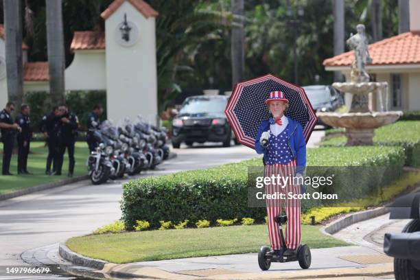 Supporter of former President Donald Trump waits for him to arrive at the Trump National Doral Miami resort on June 12, 2023 in Doral, Florida. Trump...
