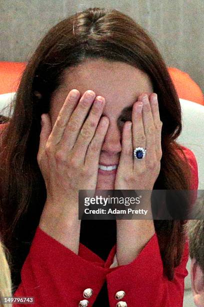 Catherine, Duchess of Cambridge reacts during the swimming finals session on Day 7 of the London 2012 Olympic Games at the Aquatics Centre on August...