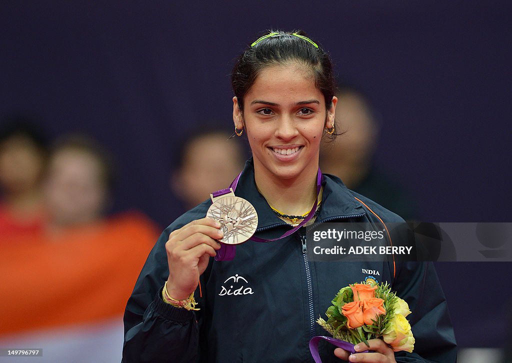 India's Saina Nehwal poses with her bron