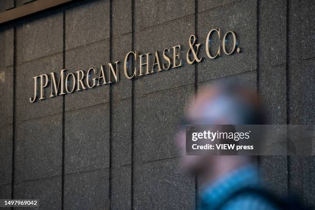 Man walks inside one of the JPMorgan Chase & Co. Buildings on June 12, 2023. In New York. JP Morgan Chase stated that it planned to settle to pay...