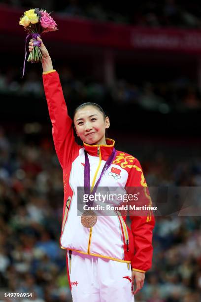 Bronze medalist Wenna He of China stands with her medal after Trampoline on Day 8 of the London 2012 Olympic Games at North Greenwich Arena on August...