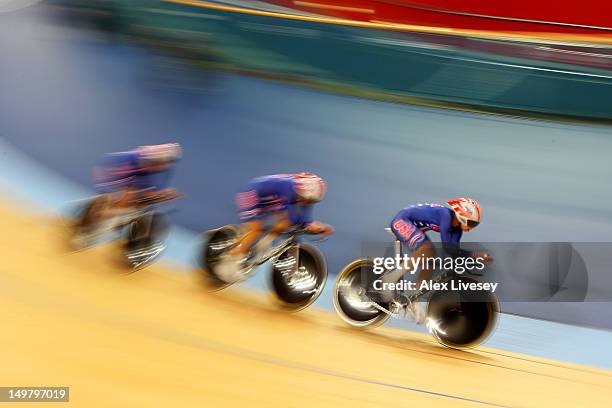 Dotsie Bausch, Jennie Reed and Sarah Hammer of the United States in action during the Women's Team Pursuit Track Cycling First Round heat against...